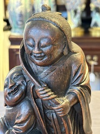 A large Chinese carved bamboo group of 'Hehe Erxian', 17th C.