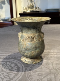 A Chinese archaic bronze ritual wine vessel with buffalo heads, 'zhi 觯', Western Zhou