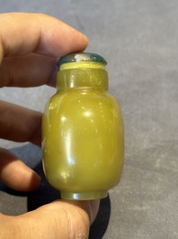 A Chinese yellow jade snuff bottle with moss agate cover and bone stopper, 19th C.