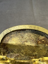 A pair of Chinese imperial gilt-bronze stirrups with dragons, De 德 mark, 18th C.