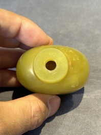 A Chinese yellow jade snuff bottle with moss agate cover and bone stopper, 19th C.