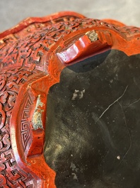 A Chinese red cinnabar lacquer jardiniere with floral design, Yongzheng/Qianlong
