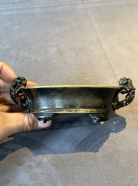 A rare Chinese bronze narcissus basin-shaped censer with dragon handles, Xuande mark, 17th C.