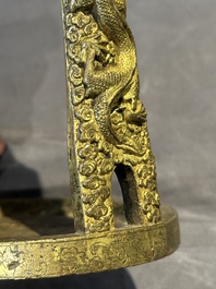 A pair of Chinese imperial gilt-bronze stirrups with dragons, De 德 mark, 18th C.