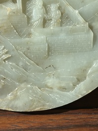 A Chinese celadon and russet jade plaque with landscape design, 19th C.