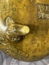 A Chinese imperial archaistic gold-splashed bronze censer and cover with chilong and 'shou' design, Xuande mark, 17th C.