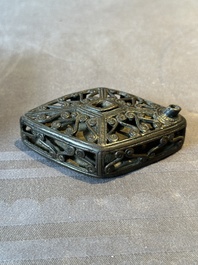 A Chinese reticulated lozenge-shaped double-walled bronze water dropper, 16th C.