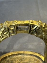 A pair of Chinese imperial gilt-bronze stirrups with dragons, De 德 mark, 18th C.