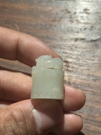 A Chinese white jade carving of a chilong reclining on bamboo, Qing