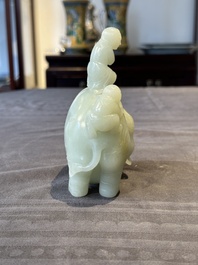 A Chinese celadon jade group of two boys cleansing an elephant, 18th C.
