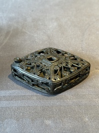 A Chinese reticulated lozenge-shaped double-walled bronze water dropper, 16th C.