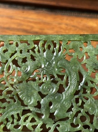 A Chinese jade 'dragon' plaque, a 'double-happiness' plaque and a jade inset silver brooch, 19th C.