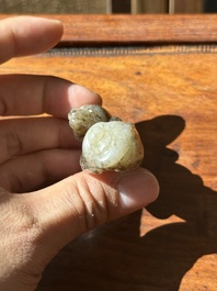 A Chinese partly black coloured white jade dog carving, Qing