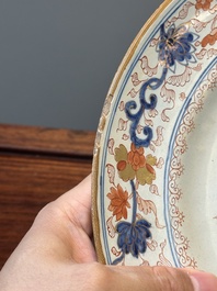 A Dutch Delft Imari-style dish with antiquities, 'AK' mark, 18th C.