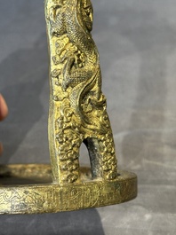 A pair of Chinese imperial gilt-bronze stirrups with dragons, De 德 mark, 18th C.