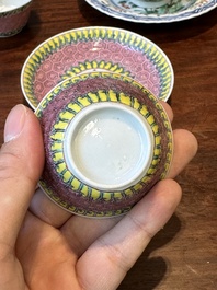 A pair of Chinese famille verte and a pair of famille rose cups and saucers, Kangxi/Yongzheng