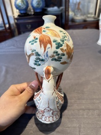 Two Chinese famille rose vases, two teapots and a Japanese wucai ewer, 19th C.