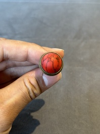 A Chinese coral-red Peking glass snuff bottle imitating a basket, 19th C.