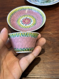 A pair of Chinese famille verte and a pair of famille rose cups and saucers, Kangxi/Yongzheng
