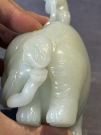 A Chinese celadon jade group of two boys cleansing an elephant, 18th C.