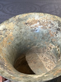 A Chinese archaic bronze ritual wine vessel with buffalo heads, 'zhi 觯', Western Zhou