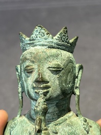 An fine Indonesian bronze sculpture of a naked man offering a sacrificial vase, Majapahit, East Java, 13/14th C.