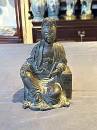 A rare Chinese parcel-gilt and lacquered pewter Guanyin, 17/18th C.