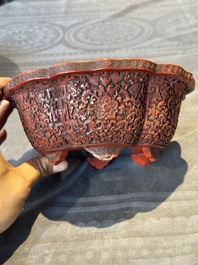 A Chinese red cinnabar lacquer jardiniere with floral design, Yongzheng/Qianlong