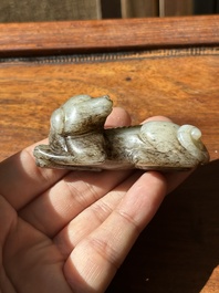 A Chinese partly black coloured white jade dog carving, Qing