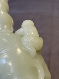 A Chinese celadon jade group of two boys cleansing an elephant, 18th C.