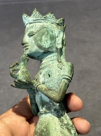 An fine Indonesian bronze sculpture of a naked man offering a sacrificial vase, Majapahit, East Java, 13/14th C.