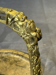 A pair of Chinese imperial gilt-bronze stirrups with dragons, De 德 mark, 18th C.