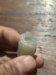 A Chinese white jade carving of a chilong reclining on bamboo, Qing