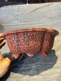 A Chinese red cinnabar lacquer jardiniere with floral design, Yongzheng/Qianlong