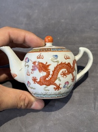 Two Chinese famille rose vases, two teapots and a Japanese wucai ewer, 19th C.