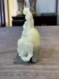 A Chinese celadon jade group of two boys cleansing an elephant, 18th C.