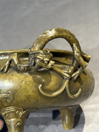 A Chinese imperial archaistic gold-splashed bronze censer and cover with chilong and 'shou' design, Xuande mark, 17th C.