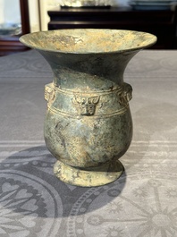 A Chinese archaic bronze ritual wine vessel with buffalo heads, 'zhi 觯', Western Zhou