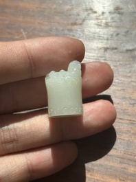 A Chinese white jade carving of a chilong reclining on bamboo, Qing