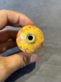 A Chinese jade snuff bottle and a yellow-ground iron-red snuff bottle, Daoguang mark, 19th C.