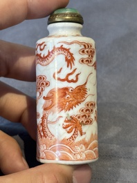 A Chinese jade carving, a tortoiseshell card holder and an iron-red snuff bottle, 19th C.