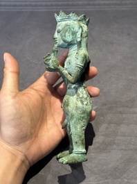 An fine Indonesian bronze sculpture of a naked man offering a sacrificial vase, Majapahit, East Java, 13/14th C.