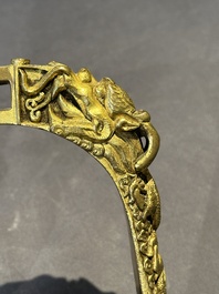 A pair of Chinese imperial gilt-bronze stirrups with dragons, De 德 mark, 18th C.