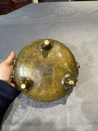 A Chinese imperial archaistic gold-splashed bronze censer and cover with chilong and 'shou' design, Xuande mark, 17th C.