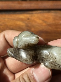 A Chinese partly black coloured white jade dog carving, Qing