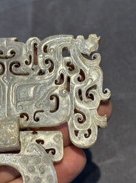 A Chinese nephrite jade 'bi' disc representing a Taotie mask, Han