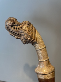 A silver plated dagger and four swords, China, Burma and Indonesia, 18/19th C.