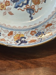 A Dutch Delft Imari-style dish with antiquities, 'AK' mark, 18th C.