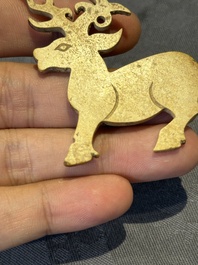 A rare Chinese calcified jade 'deer' pendant, Western Zhou