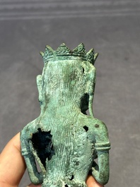 An fine Indonesian bronze sculpture of a naked man offering a sacrificial vase, Majapahit, East Java, 13/14th C.